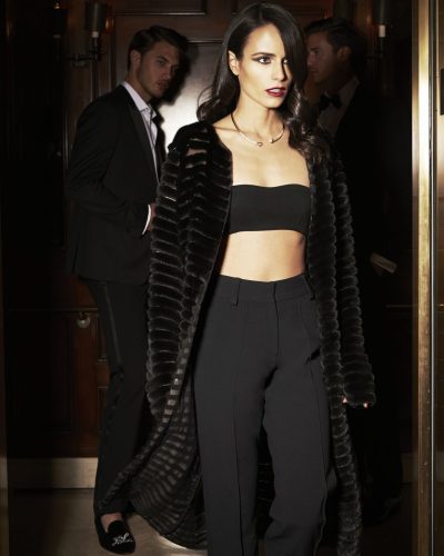 Jordana Brewster in bright red jumpsuit with modern cut and style