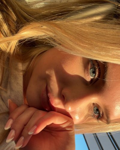 Jules Marie Jensen vibrant street style with black coat