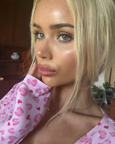 Julia Cavanagh with a pink bodysuit, casual and fun style.