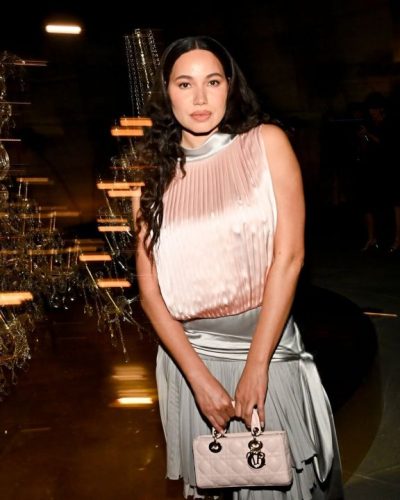 Jurnee Smollett in silk pleated dress, soft pink and silver.