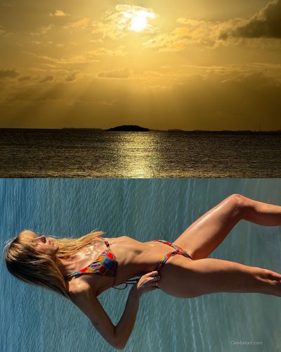 Kari Riley wearing layered jewelry with her colorful swimwear.