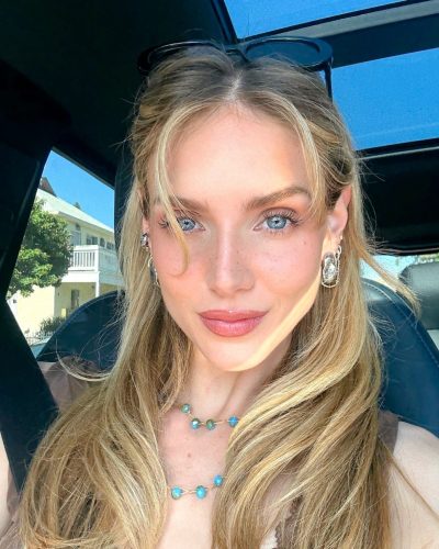 Kari Riley with a playful bikini and layered beach accessories.