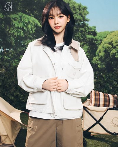 Karina with a stylish white dress and casual accessories