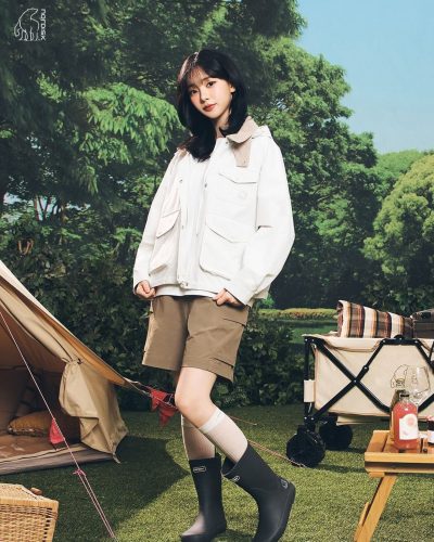 Karina wearing a chic white dress with clean lines