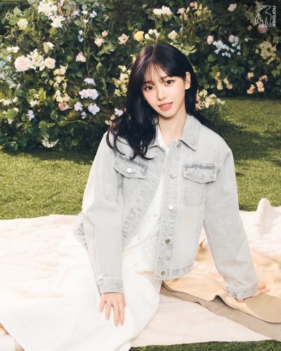 Karina wearing a comfortable white blouse and trendy pants