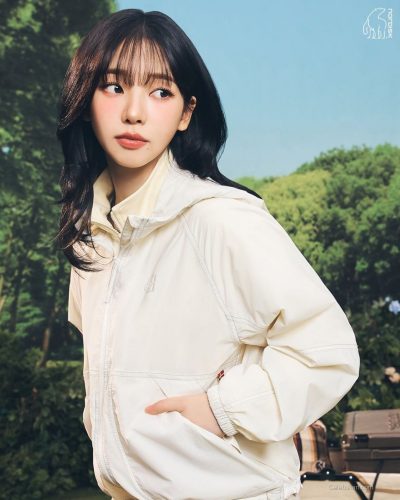 Karina in a light and airy white jumpsuit