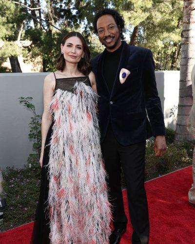 Karolina Wydra radiant dress with feather details and vibrant colors