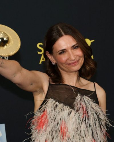 Karolina Wydra stylish gown with sheer elements and feather embellishments