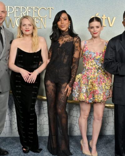 Kate Mara in a colorful floral gown and sleek hairstyle.