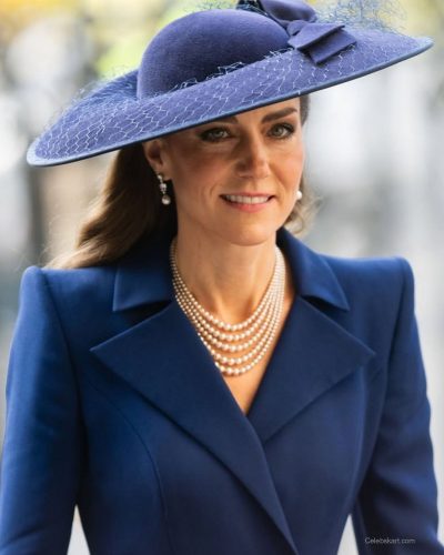 Kate Middleton navy coat dress paired with chic pearl necklace