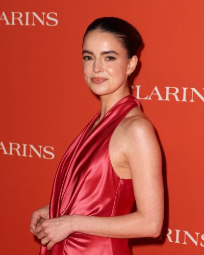 Katherine Hughes wearing red dress at appearance 2023