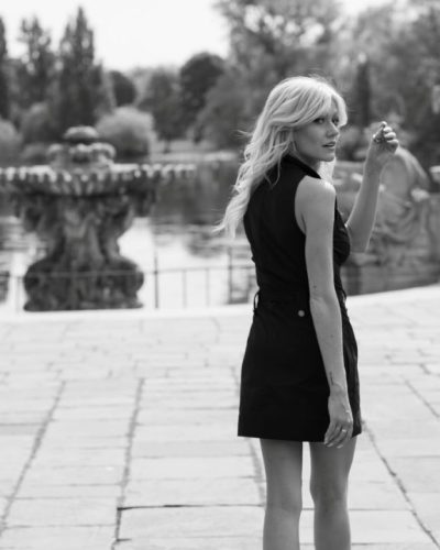 Katherine McNamara in a simple black dress with chic details