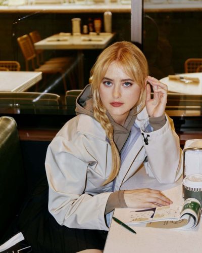 Kathryn Newton trendy beige crop top for golf fashion