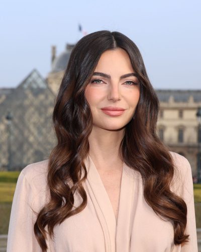 Kelly Piquet in classic beige gown with flowing fabric