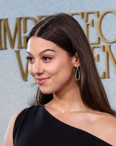 Kira Kosarin in sleek black gown at premiere 2023