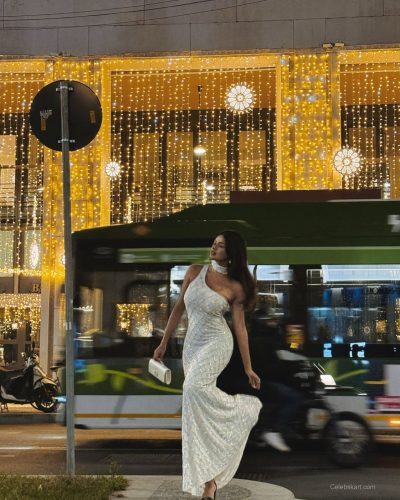 Komal Ilsanker in white dress featuring a flowing design