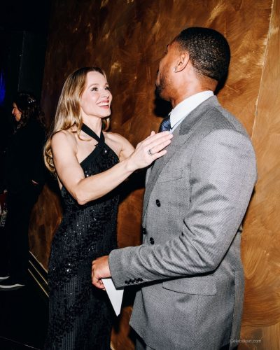 Kristen Bell black sequined gown featuring a halter neckline