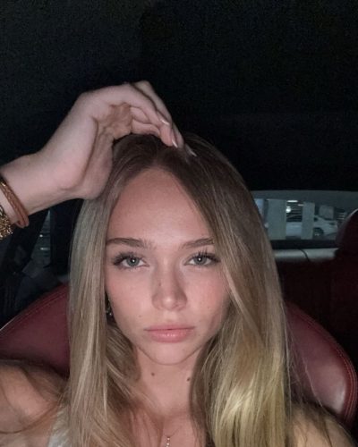 Kyla Dodds in colorful floral bikini enjoying summer vibes