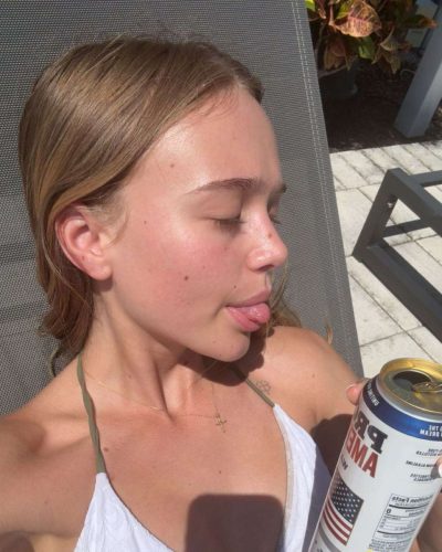 Kyla Dodds in fashionable floral bikini by the waves