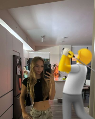 Kyla Dodds in stylish floral bikini and sunglasses