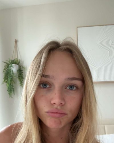 Kyla Dodds in bright floral bikini with sun-kissed skin