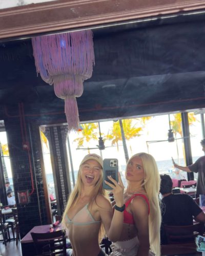 Kyla Dodds in trendy floral bikini with playful accessories