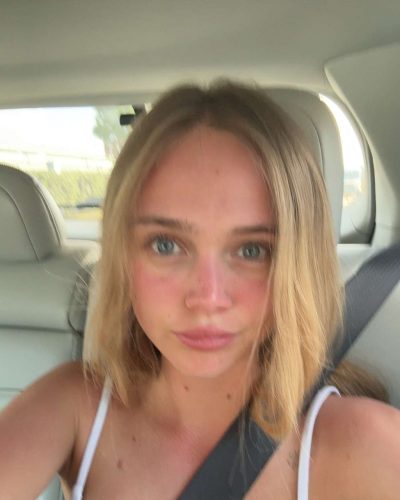 Kyla Dodds with beachy blonde hair in red bikini