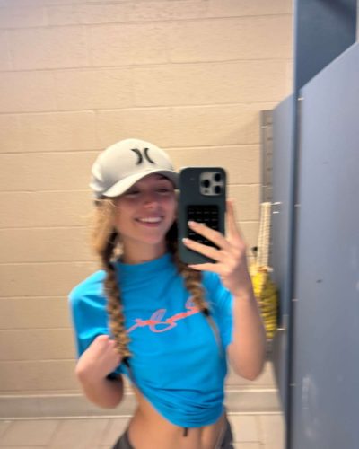 Kyla Dodds in relaxed black jacket over red bikini