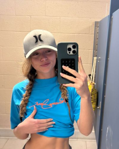 Kyla Dodds sporting denim shorts and bright red bikini