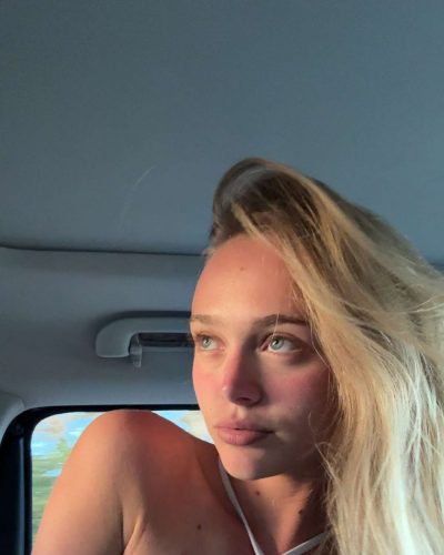 Kyla Dodds in relaxed black jacket over red bikini