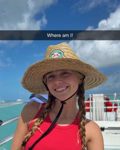 Kyla Dodds wearing red bikini with denim shorts