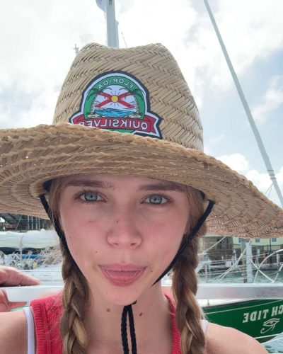 Kyla Dodds with beachy blonde hair in red bikini
