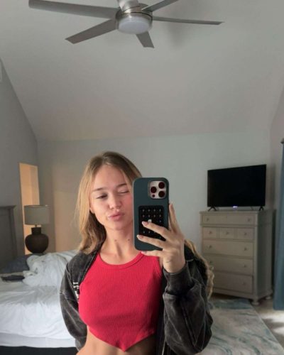 Kyla Dodds in relaxed black jacket over red bikini