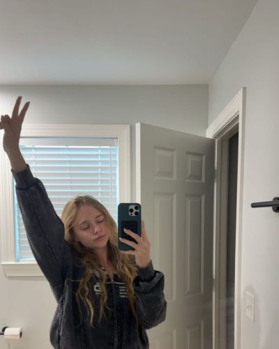 Kyla Dodds sporting denim shorts and bright red bikini