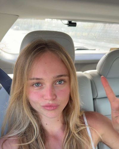 Kyla Dodds in black jacket paired with red bikini