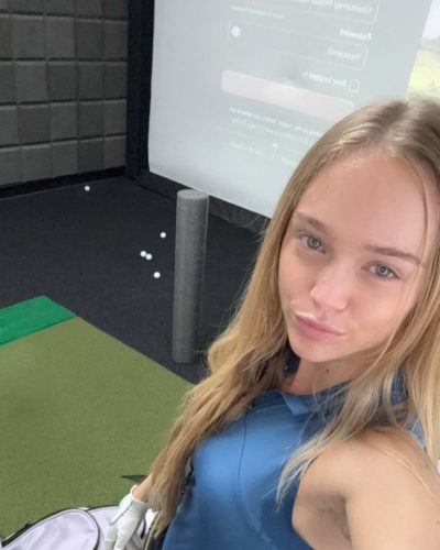 Kyla Dodds in trendy blue top paired with black leggings.