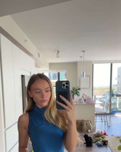 Kyla Dodds in vibrant blue top and black leggings.