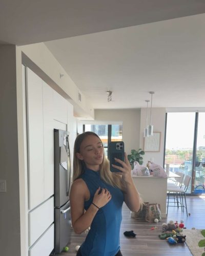 Kyla Dodds in blue top and black leggings.