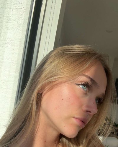 Kyla Dodds dressed in a trendy white crop top and denim.