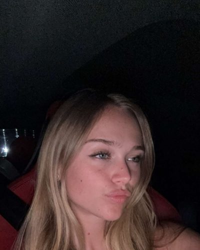 Kyla Dodds in a graphic tee featuring deep red accents.