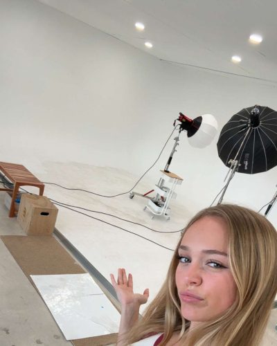 Kyla Dodds sporting a casual white crop top and shorts.