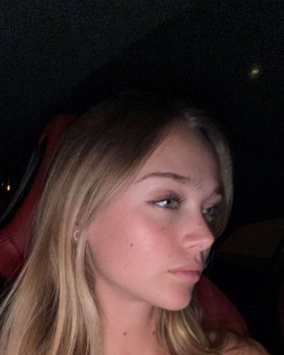 Kyla Dodds styled in a trendy crop top and relaxed shorts.