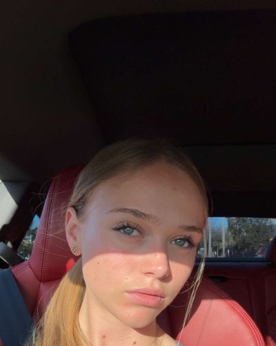 Kyla Dodds with a vintage graphic crop top and casual shorts.