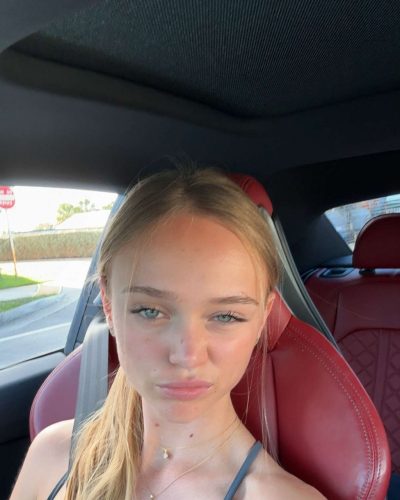 Kyla Dodds dressed in a trendy white crop top and denim.