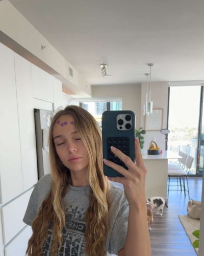 Kyla Dodds black strapless top paired with light blue jeans