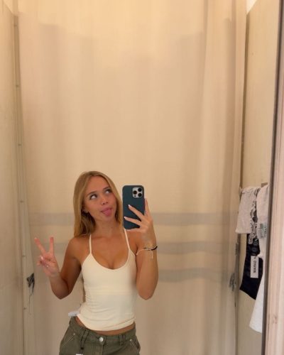 Kyla Dodds chic black strapless top and blue embellished jeans