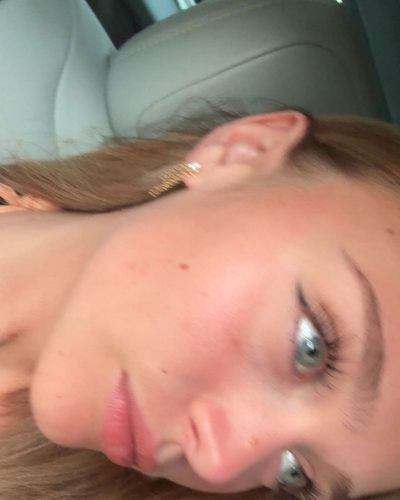 Kyla Dodds in blue bikini by the beach.