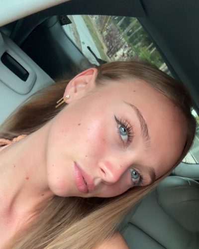 Kyla Dodds in blue bikini soaking up the sun.