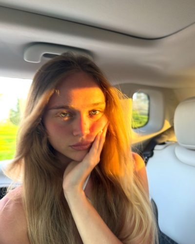 Kyla Dodds in blue bikini enjoying beach day.