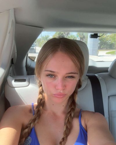 Kyla Dodds in blue bikini enjoying summer sun.